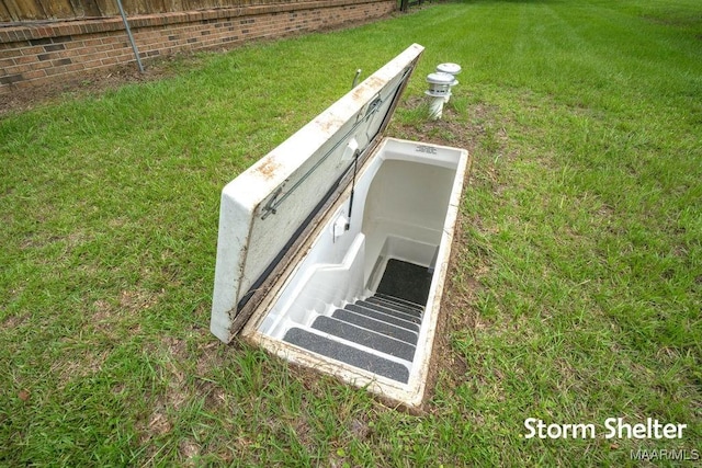 1352 Gibson Rd, Greenville, AL 36037 - view of storm shelter featuring a yard