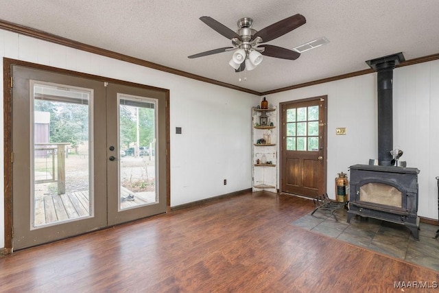 1352 Gibson Rd, Greenville, AL 36037 - doorway featuring ornamental molding, a wood stove, wood finished floors, french doors, and ceiling fan