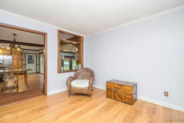 1352 Gibson Rd, Greenville, AL 36037 - sitting room featuring light wood-type flooring, ornamental molding, and a chandelier