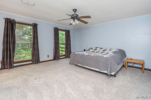 1352 Gibson Rd, Greenville, AL 36037 - carpeted bedroom with crown molding, ceiling fan, and a textured ceiling