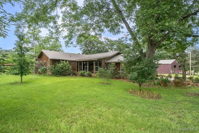 1352 Gibson Rd, Greenville, AL 36037 - back of property featuring a yard and a metal roof
