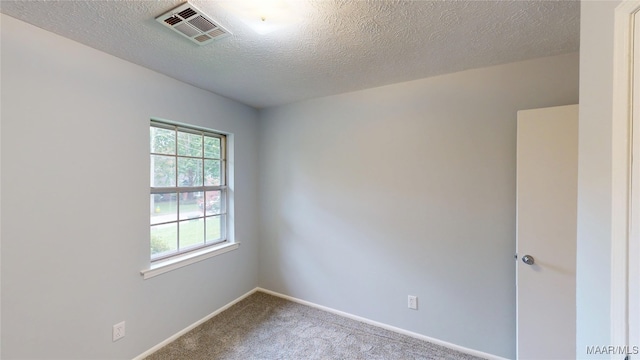 461 Glade Park Dr, Montgomery, AL 36109 - empty room with carpet flooring and a textured ceiling