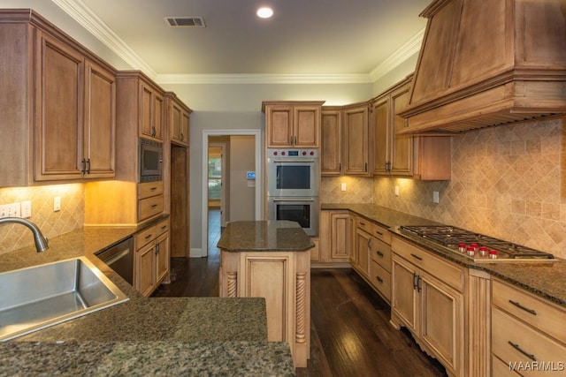 7025 Wynlakes Blvd, Montgomery, AL 36117 - kitchen with stainless steel appliances, premium range hood, dark wood-style floors, ornamental molding, and dark stone counters