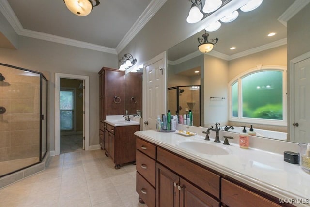 7025 Wynlakes Blvd, Montgomery, AL 36117 - bathroom featuring a shower stall, two vanities, healthy amount of natural light, tile patterned flooring, and crown molding