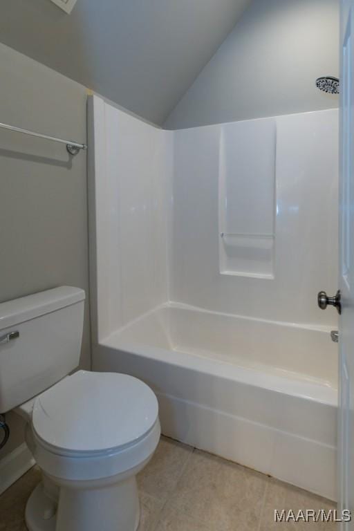 7025 Wynlakes Blvd, Montgomery, AL 36117 - full bathroom featuring tile patterned floors, shower / bathtub combination, and vaulted ceiling