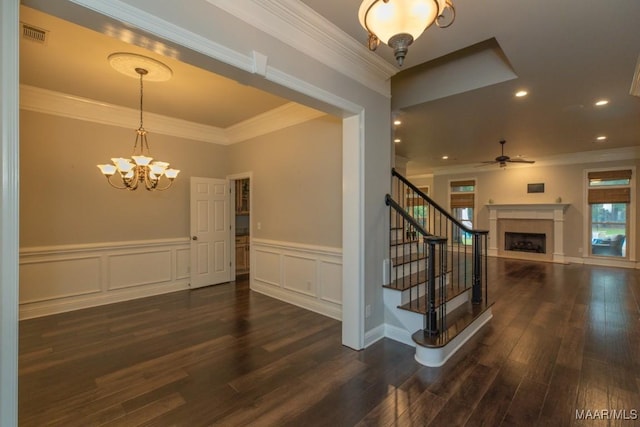 7025 Wynlakes Blvd, Montgomery, AL 36117 - stairway featuring a ceiling fan, a fireplace, wood finished floors, ornamental molding, and a chandelier