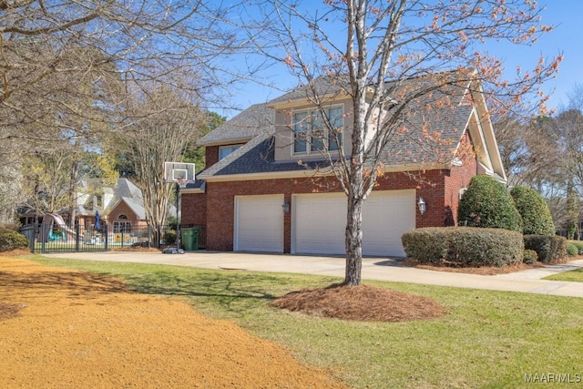 7025 Wynlakes Blvd, Montgomery, AL 36117 - view of front of property featuring brick siding, a garage, driveway, and roof with shingles