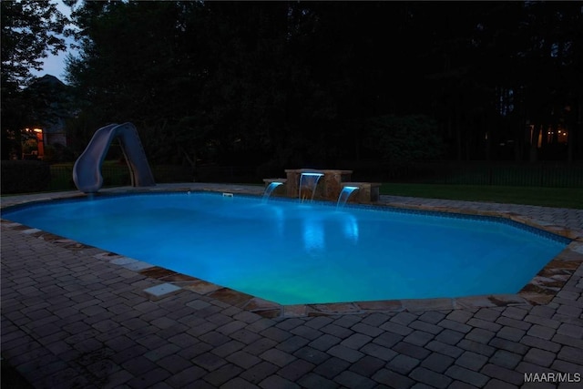 7025 Wynlakes Blvd, Montgomery, AL 36117 - view of swimming pool with a water slide, a fenced backyard, and a patio area