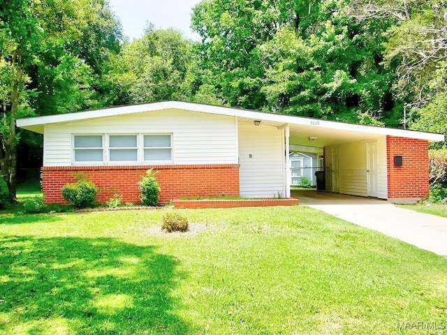 3609 Loxley Ln, Montgomery, AL 36109 - view of front of house featuring brick siding, concrete driveway, a front yard, and a carport