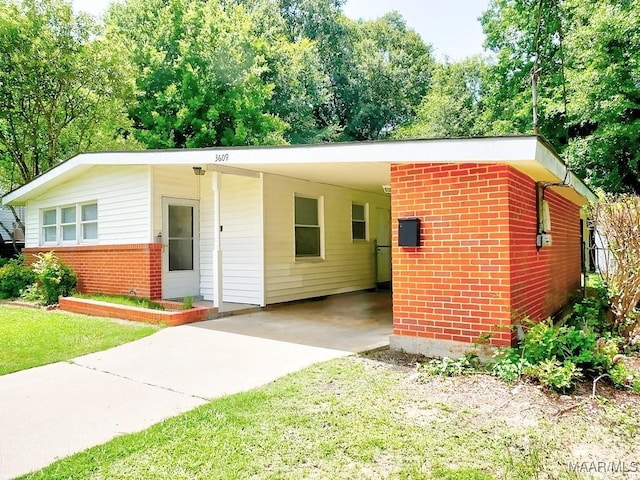 3609 Loxley Ln, Montgomery, AL 36109 - view of front of home with driveway, brick siding, and an attached carport