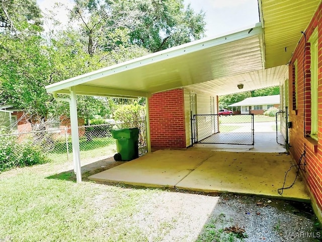3609 Loxley Ln, Montgomery, AL 36109 - view of parking featuring a gate and an attached carport
