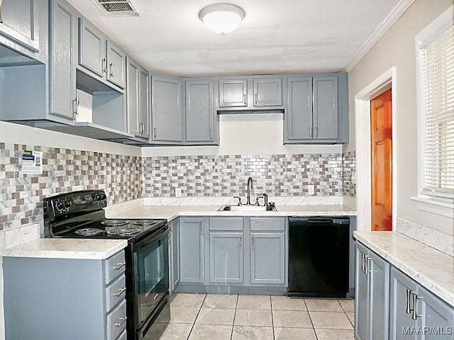 3609 Loxley Ln, Montgomery, AL 36109 - kitchen with black appliances, gray cabinetry, light tile patterned floors, and decorative backsplash