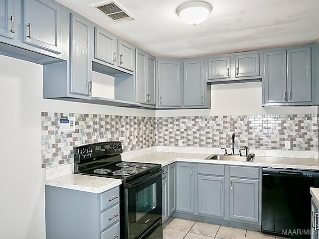 3609 Loxley Ln, Montgomery, AL 36109 - kitchen featuring black appliances, gray cabinetry, light countertops, and tasteful backsplash
