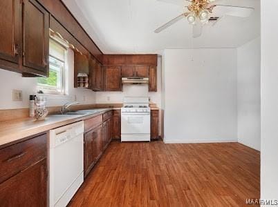 1219 First Ave, Tuskegee, AL 36088 - kitchen with white appliances, under cabinet range hood, ceiling fan, wood finished floors, and light countertops