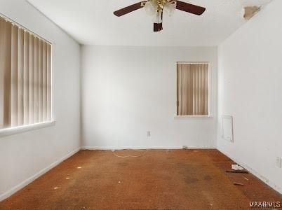 1219 First Ave, Tuskegee, AL 36088 - carpeted empty room featuring a ceiling fan