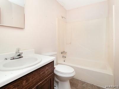 1219 First Ave, Tuskegee, AL 36088 - bathroom featuring vanity and bathtub / shower combination