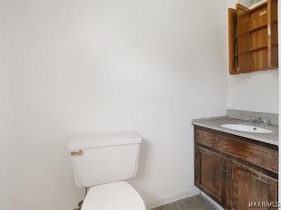 1219 First Ave, Tuskegee, AL 36088 - half bathroom with vanity and toilet