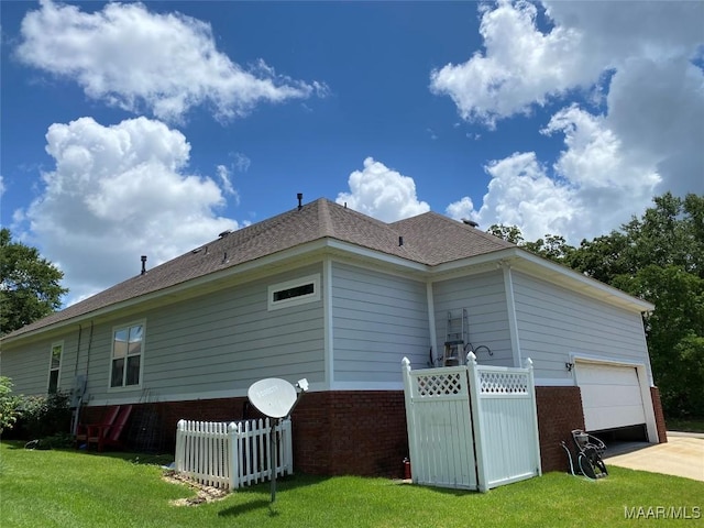 1210 Sadie Cir, Prattville, AL 36066 - view of side of property with brick siding, an attached garage, roof with shingles, and concrete driveway