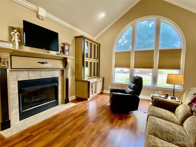 1210 Sadie Cir, Prattville, AL 36066 - living area featuring ornamental molding, lofted ceiling, wood finished floors, and a fireplace