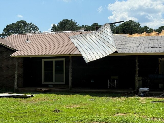 6700 Al Highway 22 N, Valley Grande, AL 36701 - back of house with a lawn and a metal roof