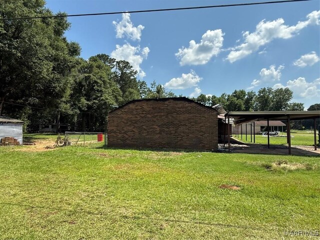 6700 Al Highway 22 N, Valley Grande, AL 36701 - view of green lawn featuring a carport