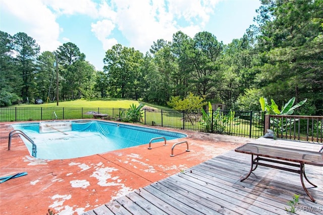 1245 Providence Rd, Titus, AL 36080 - view of swimming pool featuring a wooden deck and view of wooded area