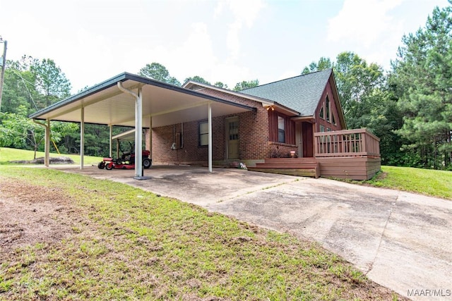 1245 Providence Rd, Titus, AL 36080 - view of front of home featuring driveway, a front yard, brick siding, an attached carport, and roof with shingles