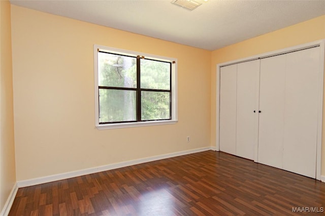 1245 Providence Rd, Titus, AL 36080 - unfurnished bedroom featuring dark wood-style floors and a closet