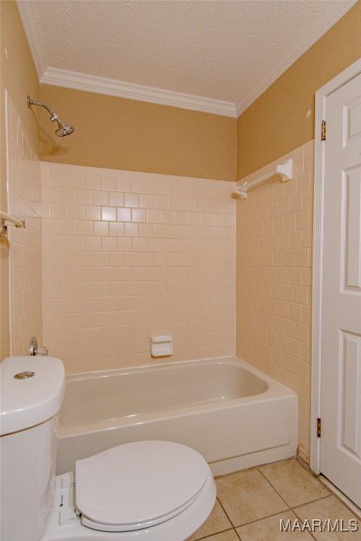 1245 Providence Rd, Titus, AL 36080 - full bath featuring tile patterned flooring, bathtub / shower combination, a textured ceiling, ornamental molding, and tile walls