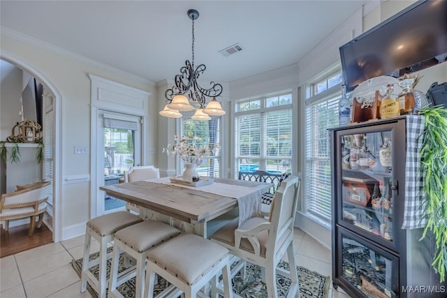 742 Mckeithen Pl, Millbrook, AL 36054 - dining space with a chandelier, light tile patterned flooring, healthy amount of natural light, and ornamental molding
