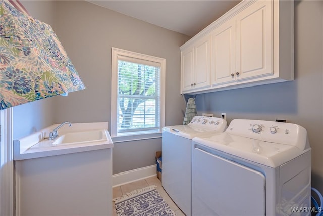 742 Mckeithen Pl, Millbrook, AL 36054 - laundry area with cabinet space, independent washer and dryer, and light tile patterned flooring