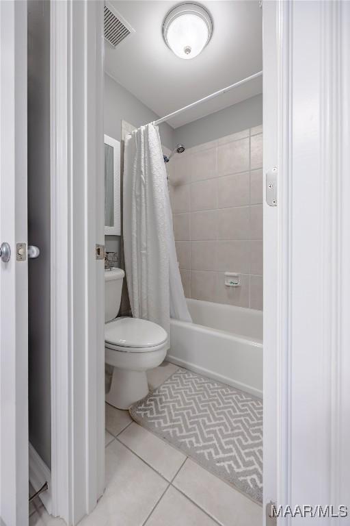 742 Mckeithen Pl, Millbrook, AL 36054 - bathroom featuring tile patterned floors and shower / tub combo with curtain