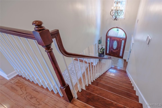 742 Mckeithen Pl, Millbrook, AL 36054 - stairway featuring hardwood / wood-style flooring and a chandelier