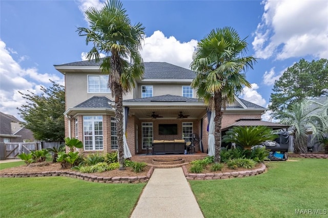 742 Mckeithen Pl, Millbrook, AL 36054 - traditional home with a ceiling fan, an outdoor living space, stucco siding, and brick siding