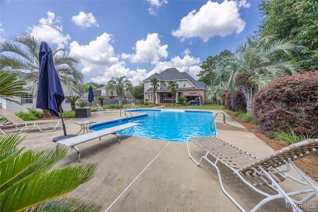 742 Mckeithen Pl, Millbrook, AL 36054 - swimming pool featuring a patio and a diving board