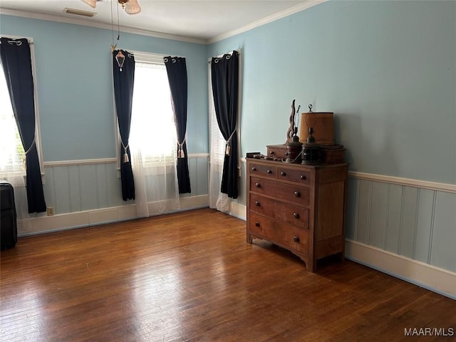 309 Broad St, Camden, AL 36726 - bedroom with wood finished floors, ornamental molding, and wainscoting