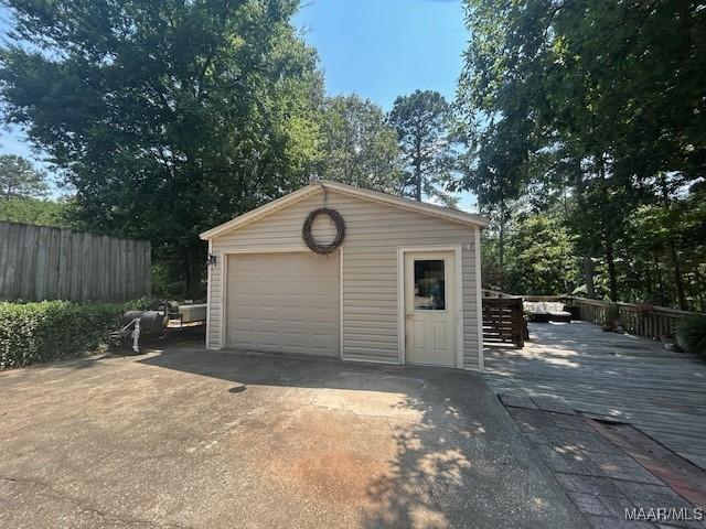 124 Reid Cir, Deatsville, AL 36022 - detached garage featuring concrete driveway
