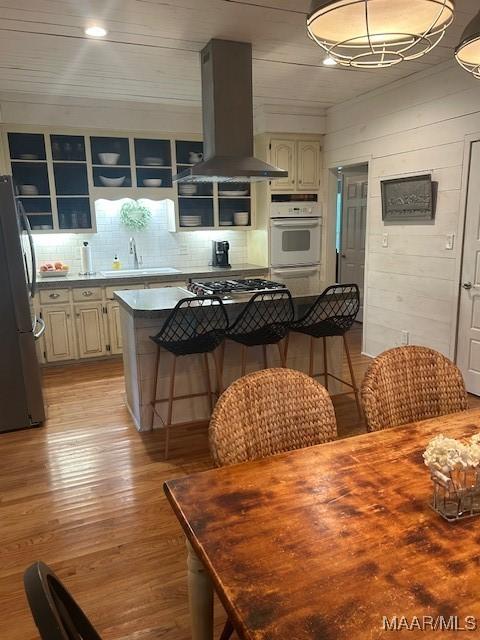 124 Reid Cir, Deatsville, AL 36022 - dining room with light wood-style flooring and wood walls