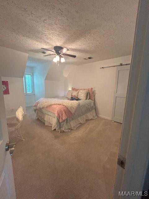 124 Reid Cir, Deatsville, AL 36022 - bedroom with carpet floors, a textured ceiling, and ceiling fan