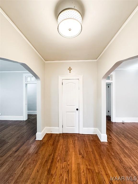 3155 Wilmington Rd, Montgomery, AL 36105 - empty room with arched walkways, wood finished floors, and ornamental molding