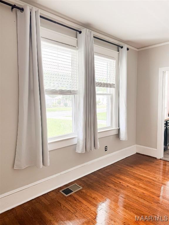 3155 Wilmington Rd, Montgomery, AL 36105 - unfurnished room with wood finished floors, healthy amount of natural light, and ornamental molding