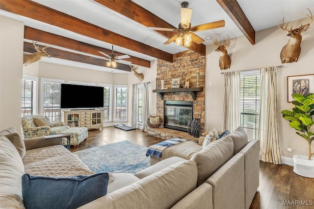 215 Hickory Rd, Titus, AL 36080 - living room with ceiling fan, beamed ceiling, a fireplace, and dark wood-style flooring