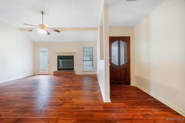 6605 E Aberdeen Dr, Montgomery, AL 36116 - foyer with wood finished floors, healthy amount of natural light, ceiling fan, vaulted ceiling, and a fireplace