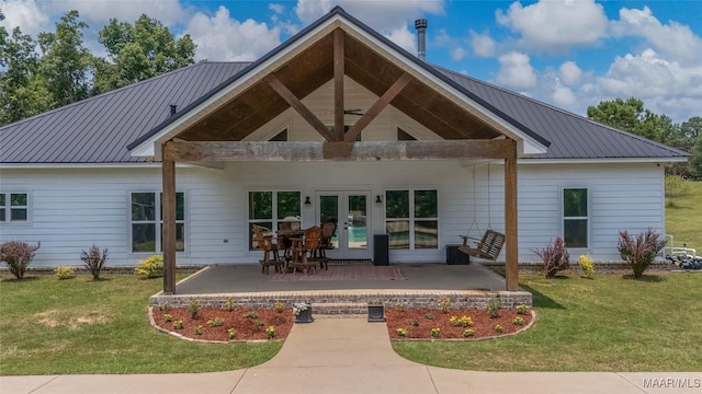 362 Driver Rd, Deatsville, AL 36022 - back of house featuring a lawn and a metal roof