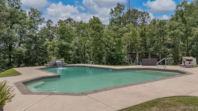 362 Driver Rd, Deatsville, AL 36022 - swimming pool featuring a patio and view of scattered trees