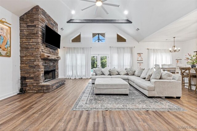 362 Driver Rd, Deatsville, AL 36022 - living area with ceiling fan, a fireplace, a chandelier, wood finished floors, and high vaulted ceiling