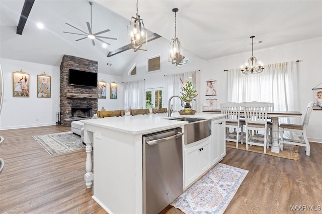 362 Driver Rd, Deatsville, AL 36022 - kitchen featuring stainless steel dishwasher, a stone fireplace, open floor plan, dark wood-style flooring, and high vaulted ceiling