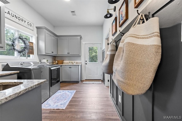 362 Driver Rd, Deatsville, AL 36022 - laundry room with cabinet space, washing machine and dryer, and dark wood finished floors