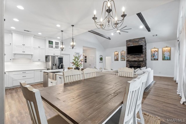 362 Driver Rd, Deatsville, AL 36022 - dining space with a chandelier, wood finished floors, a fireplace, and recessed lighting