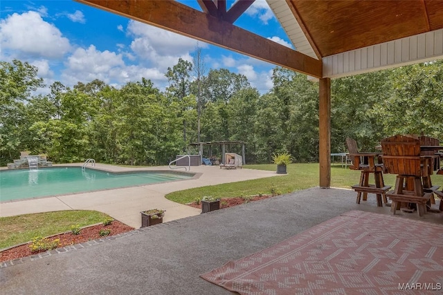 362 Driver Rd, Deatsville, AL 36022 - outdoor pool with a patio area, a yard, and view of wooded area